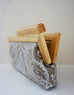 Linen Damask print fabric with  natural wood frame clutch open