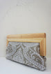 Linen Damask print fabric with  natural wood frame clutch side
